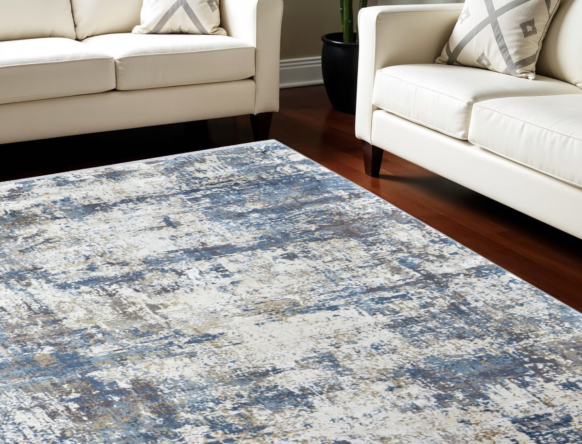 8' X 11' Ivory Tan and Blue Abstract Power Loom Area Rug With Fringe