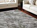 8' X 11' Taupe and Gray Abstract Power Loom Area Rug With Fringe
