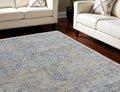 9' X 12' Gray Blue and Tan Abstract Hand Woven Distressed Area Rug With Fringe