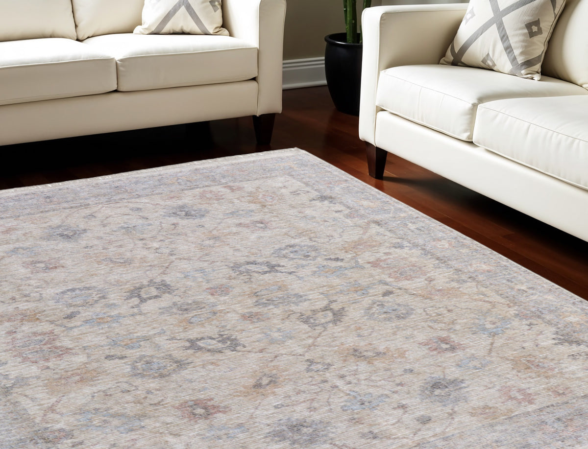 9' X 12' Ivory Tan and Blue Floral Hand Woven Distressed Area Rug With Fringe
