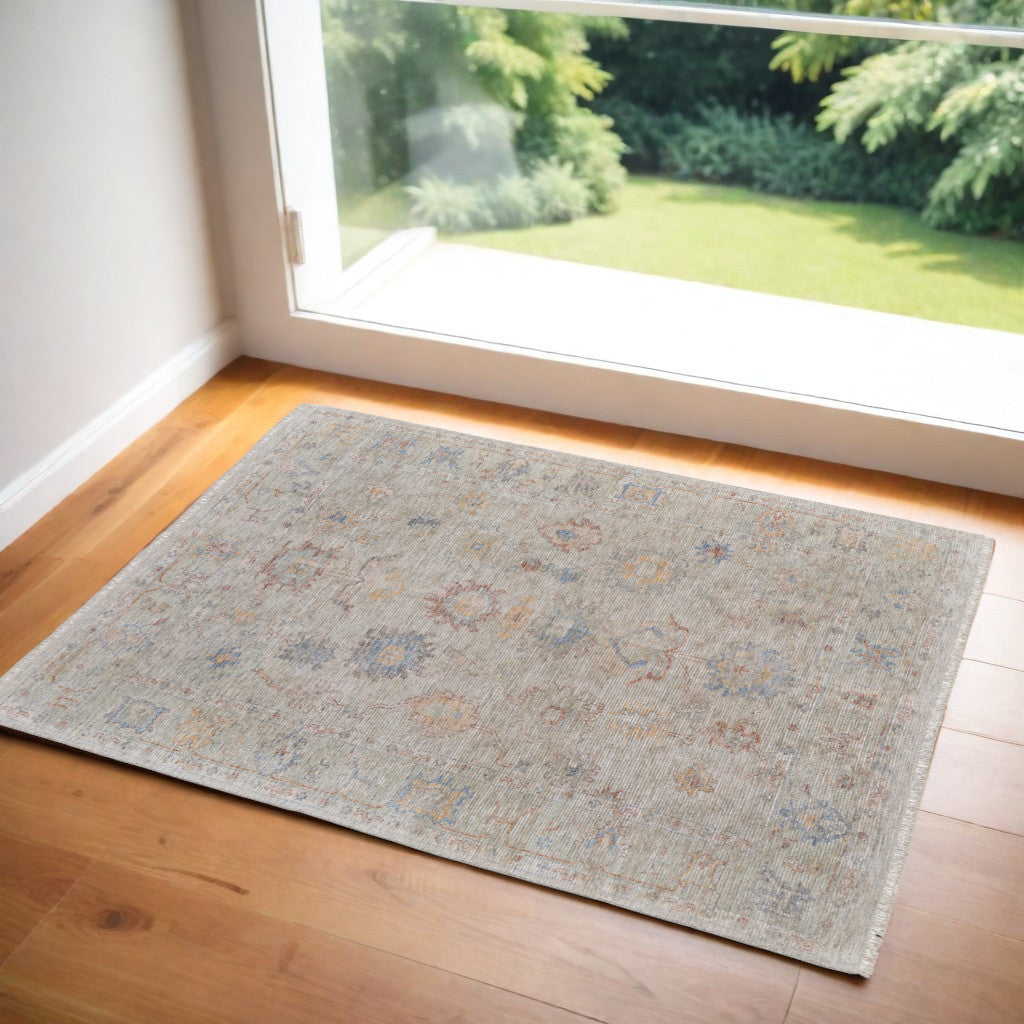 2' X 3' Tan Brown and Blue Floral Hand Woven Distressed Area Rug With Fringe