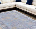 8' X 10' Orange Blue and Gold Floral Hand Woven Distressed Area Rug With Fringe