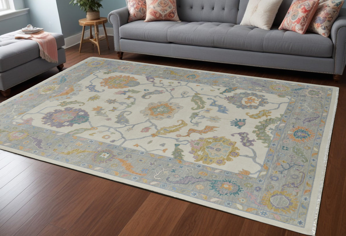 8' X 12' Gray Ivory and Orange Wool Floral Hand Knotted Area Rug With Fringe