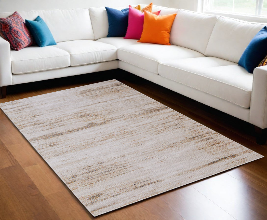 5' X 8' Ivory and Tan Abstract Power Loom Worn Faded Area Rug