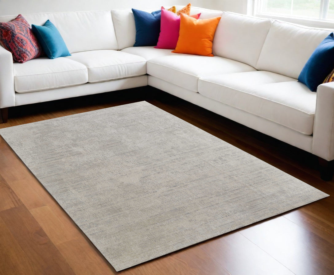5' X 8' Gray and Ivory Abstract Hand Woven Worn Faded Area Rug