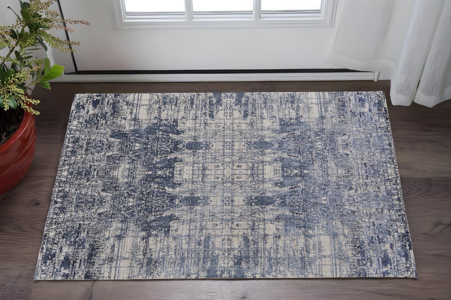 2' X 3' Blue and Ivory Abstract Hand Woven Worn Faded Area Rug