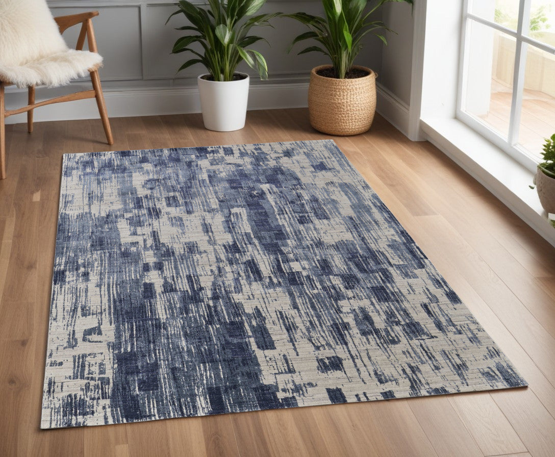 4' X 6' Blue and Ivory Abstract Hand Woven Worn Faded Area Rug
