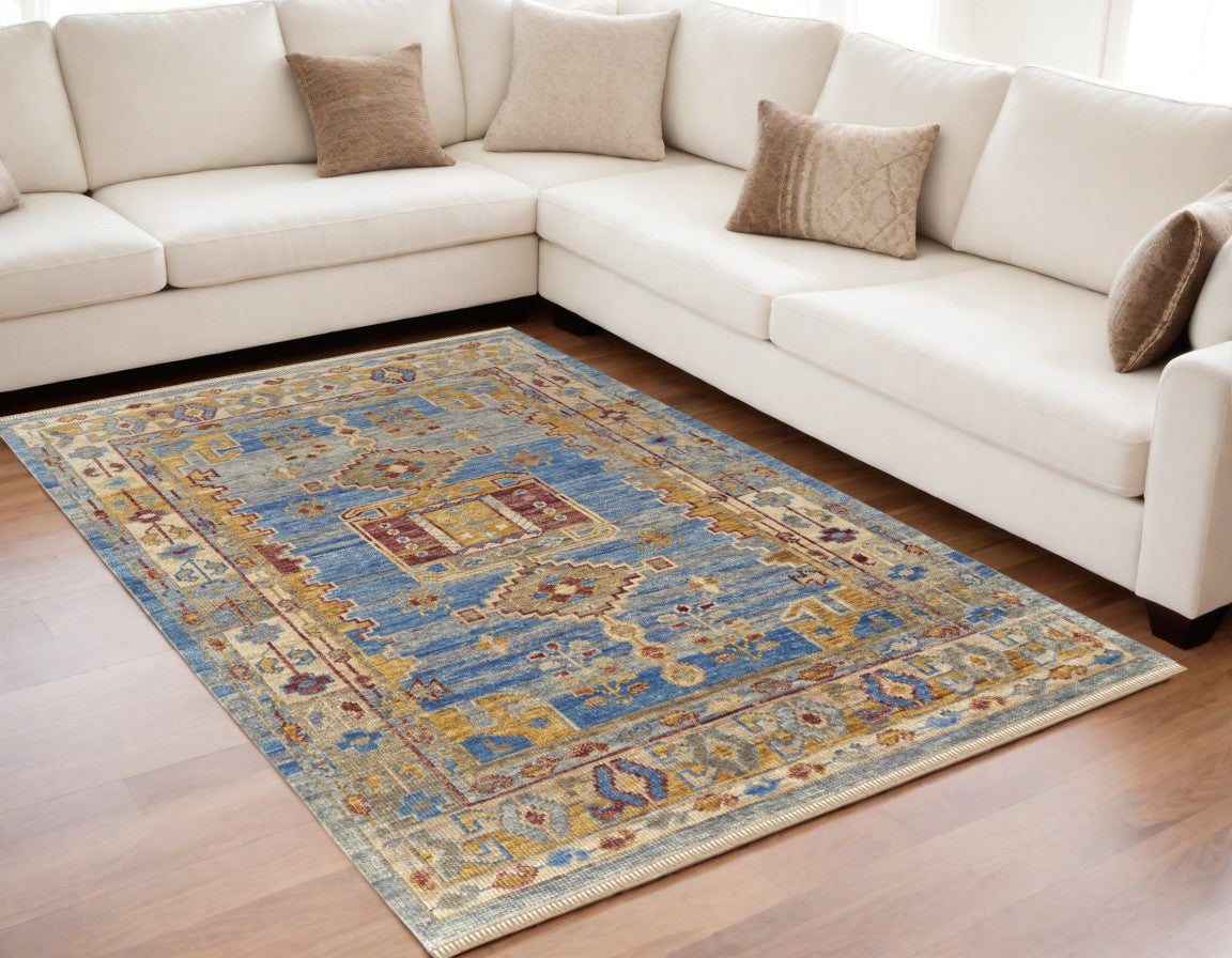5' X 8' Blue Red and Yellow Wool Geometric Hand Knotted Area Rug With Fringe