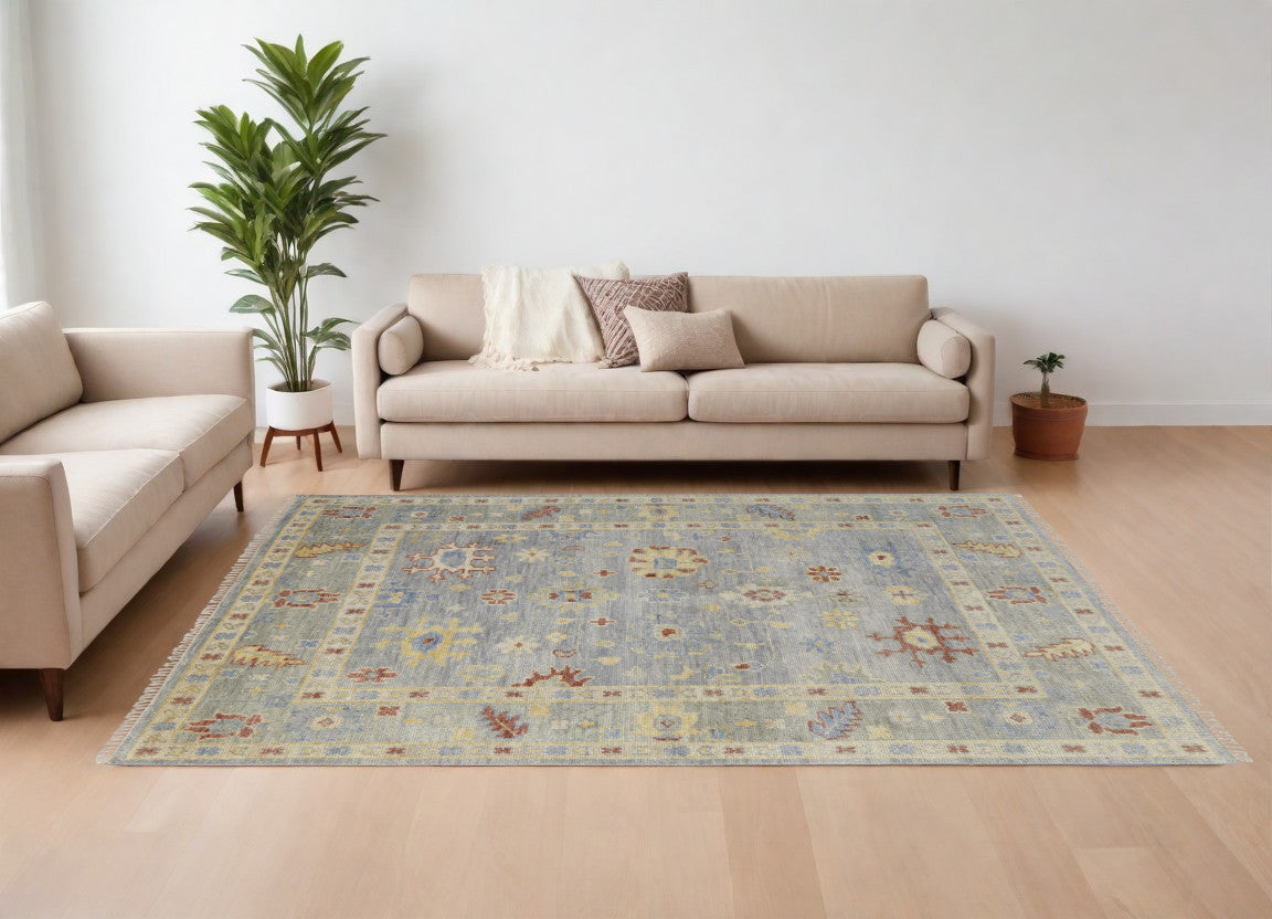 9' X 12' Light Blue and Taupe Wool Floral Hand Knotted Area Rug With Fringe