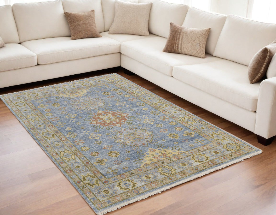 5' X 8' Green Blue and Yellow Wool Geometric Hand Knotted Area Rug With Fringe