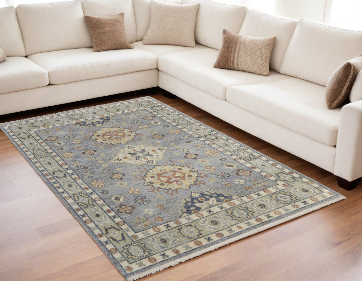 5' X 8' Gray Blue and Taupe Wool Geometric Hand Knotted Area Rug With Fringe