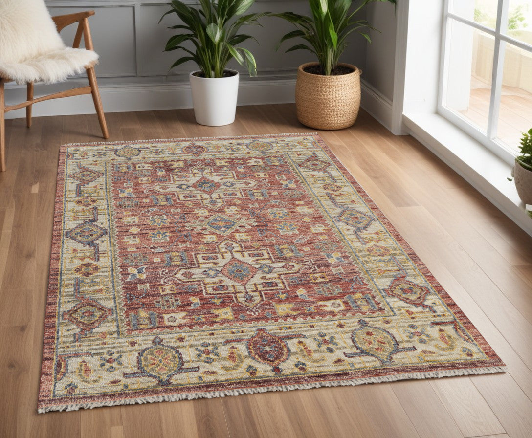 4' X 6' Ivory Red and Gold Wool Oriental Hand Knotted Area Rug With Fringe