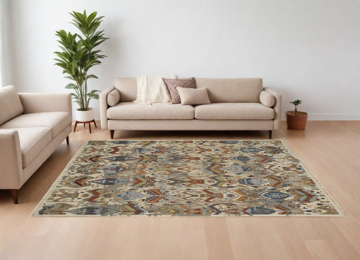 9' X 13' Ivory Blue and Brown Wool Ikat Hand Knotted Area Rug With Fringe