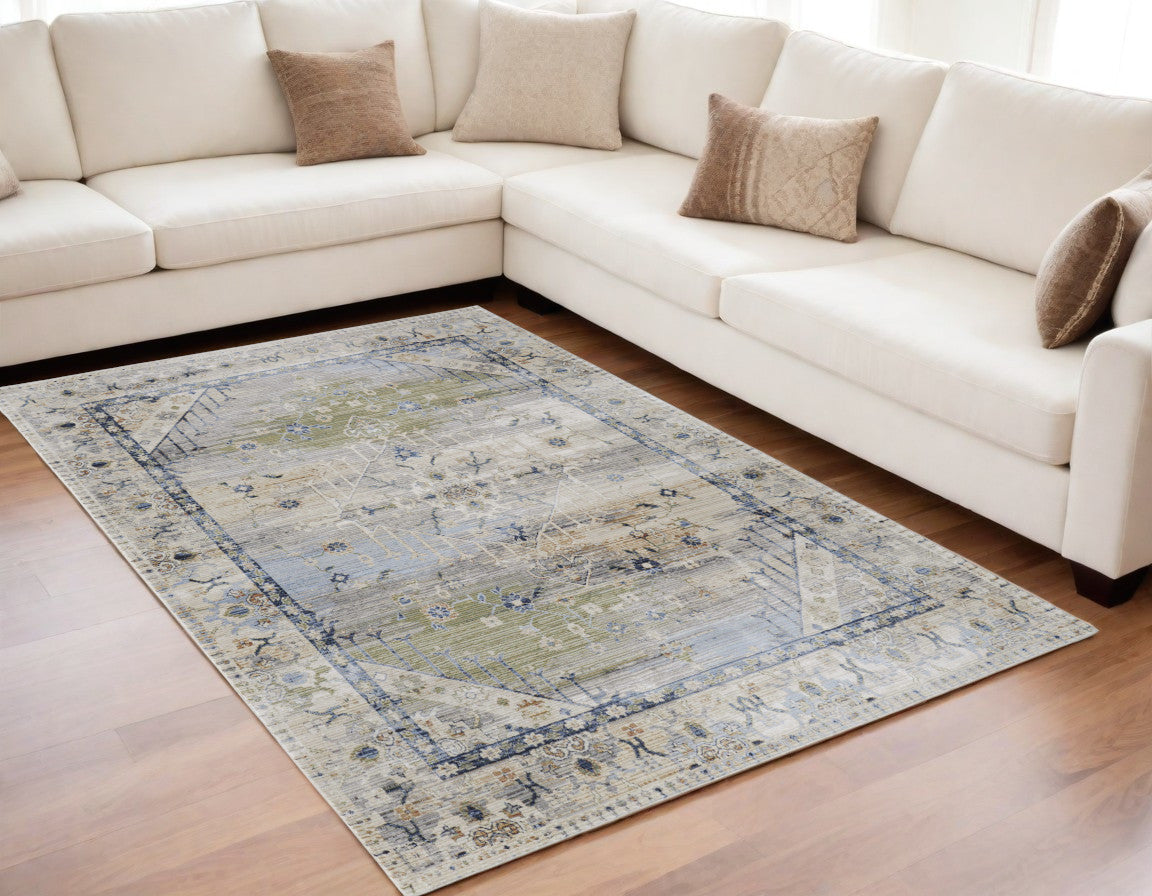 5' X 8' Ivory Green and Blue Abstract Power Loom Worn Faded Area Rug
