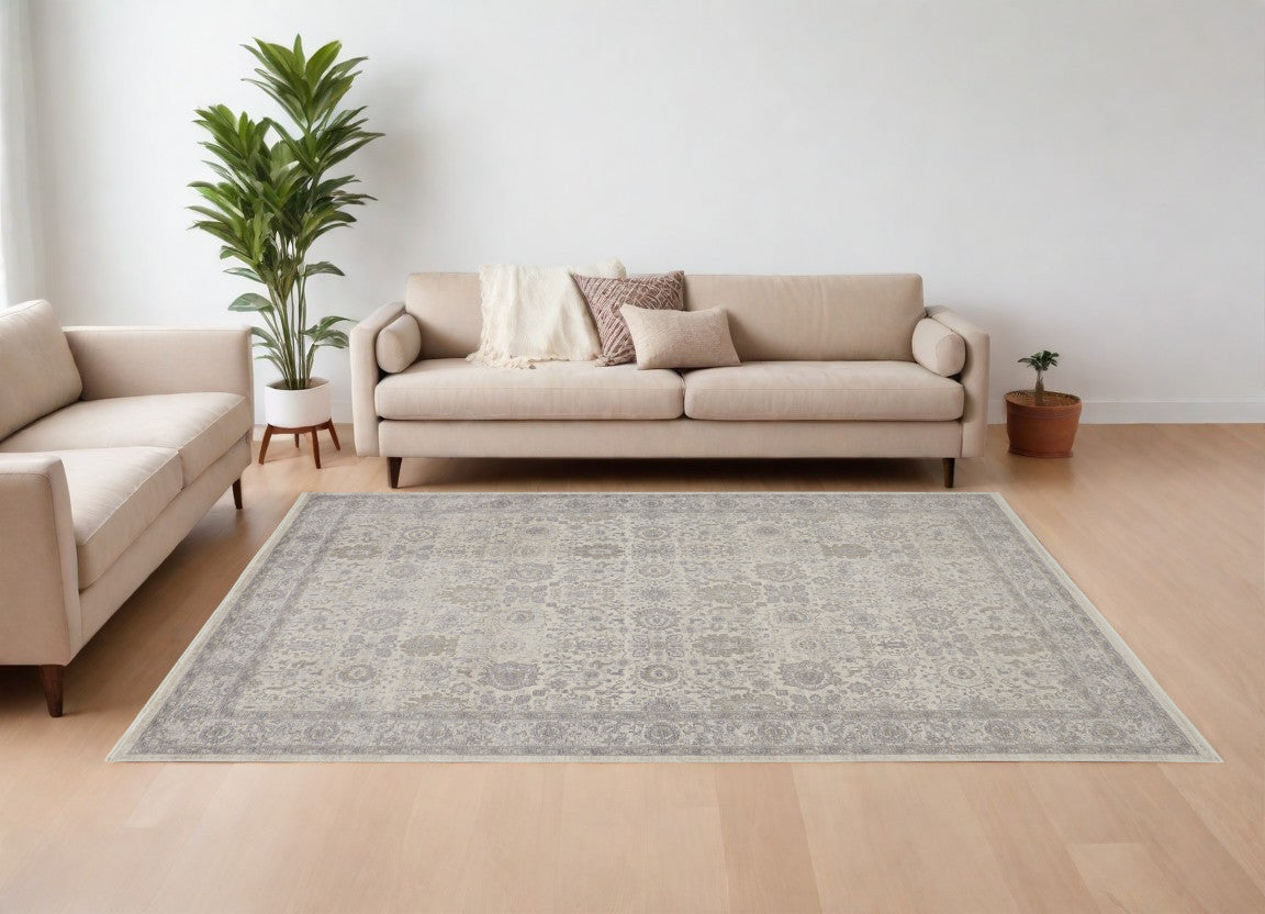 9' X 13' Gray and Ivory Oriental Power Loom Worn Faded Area Rug With Fringe