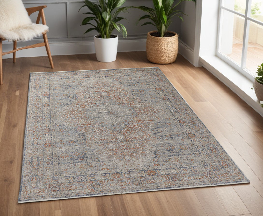 4' X 5' Gray Ivory and Orange Oriental Power Loom Worn Faded Area Rug With Fringe