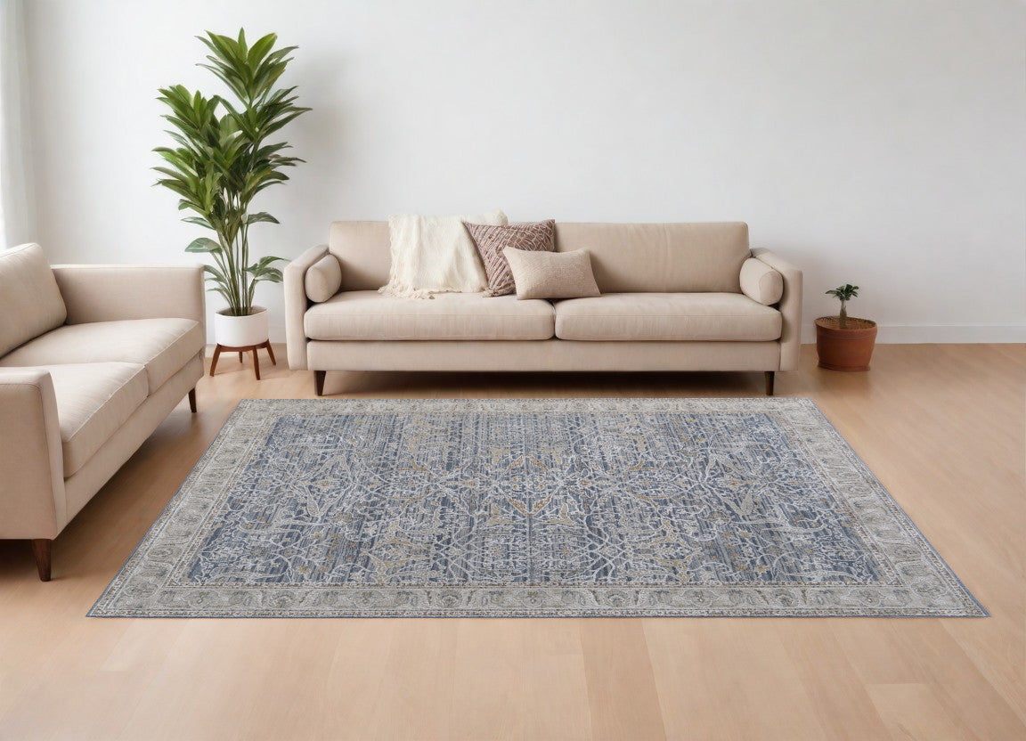 9' X 13' Taupe and Blue Ikat Power Loom Worn Faded Area Rug With Fringe