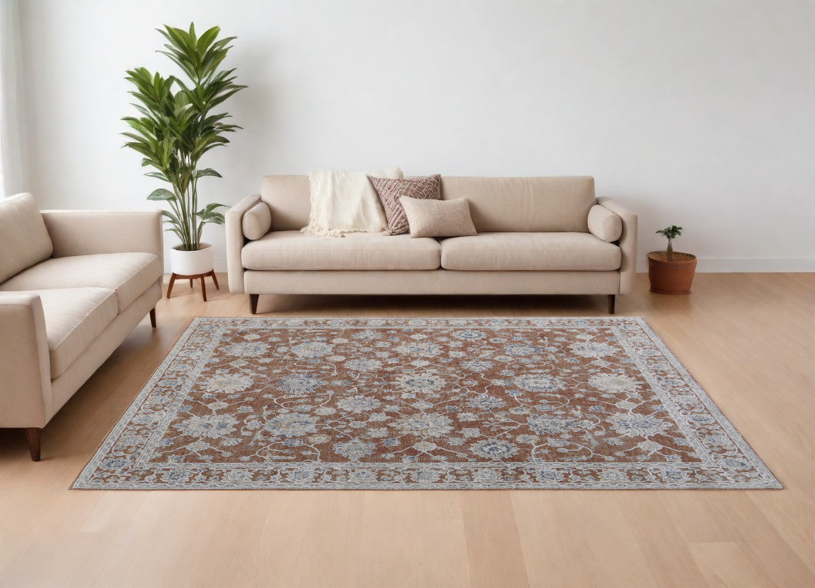 8' X 10' Red Blue and Ivory Floral Power Loom Worn Faded Area Rug With Fringe