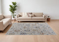 7' X 10' Ivory Blue and Gold Floral Power Loom Worn Faded Area Rug With Fringe