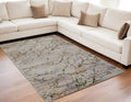 5' X 8' Taupe Green and Tan Abstract Power Loom Area Rug