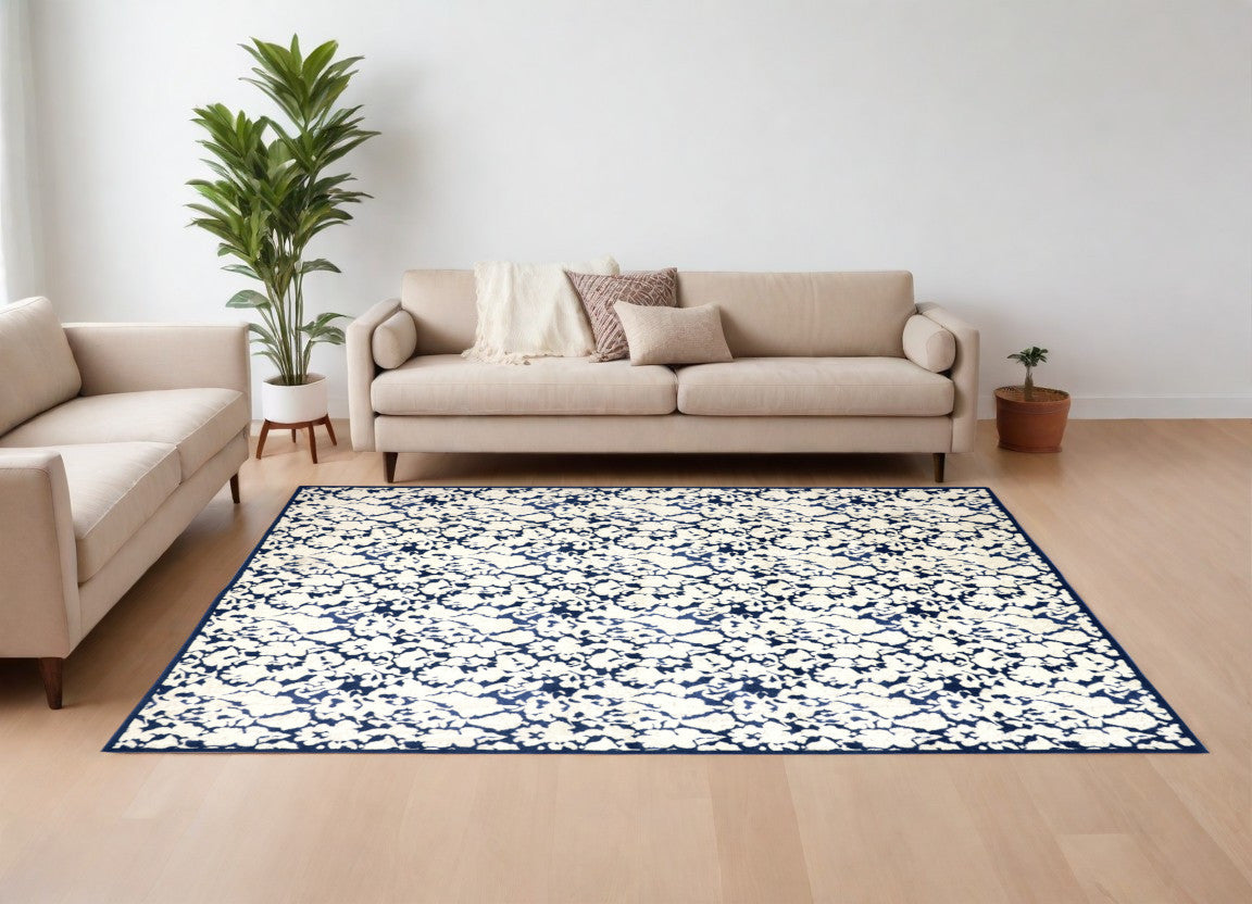 10' X 13' Blue and Ivory Abstract Power Loom Area Rug