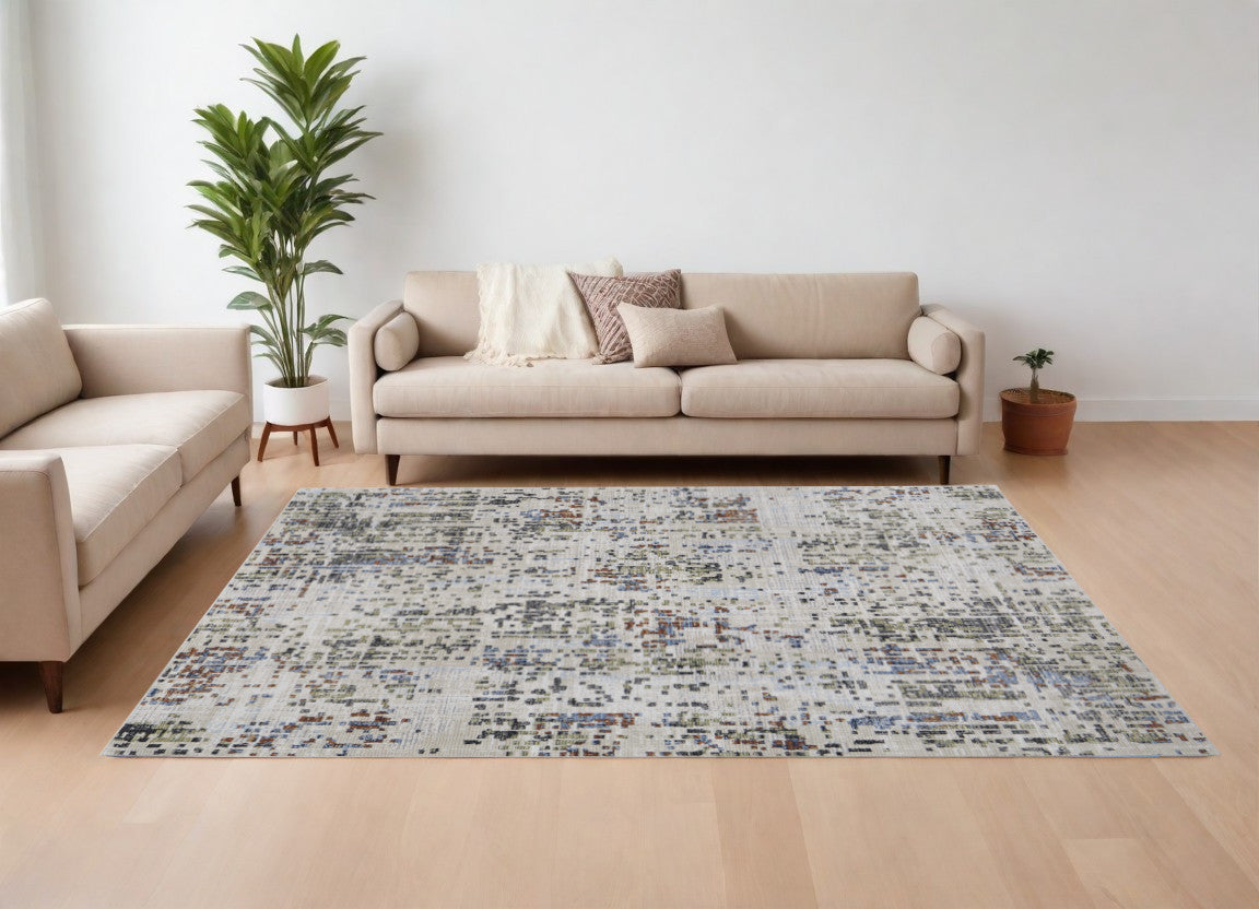 9' X 13' Ivory Green and Blue Abstract Power Loom Area Rug