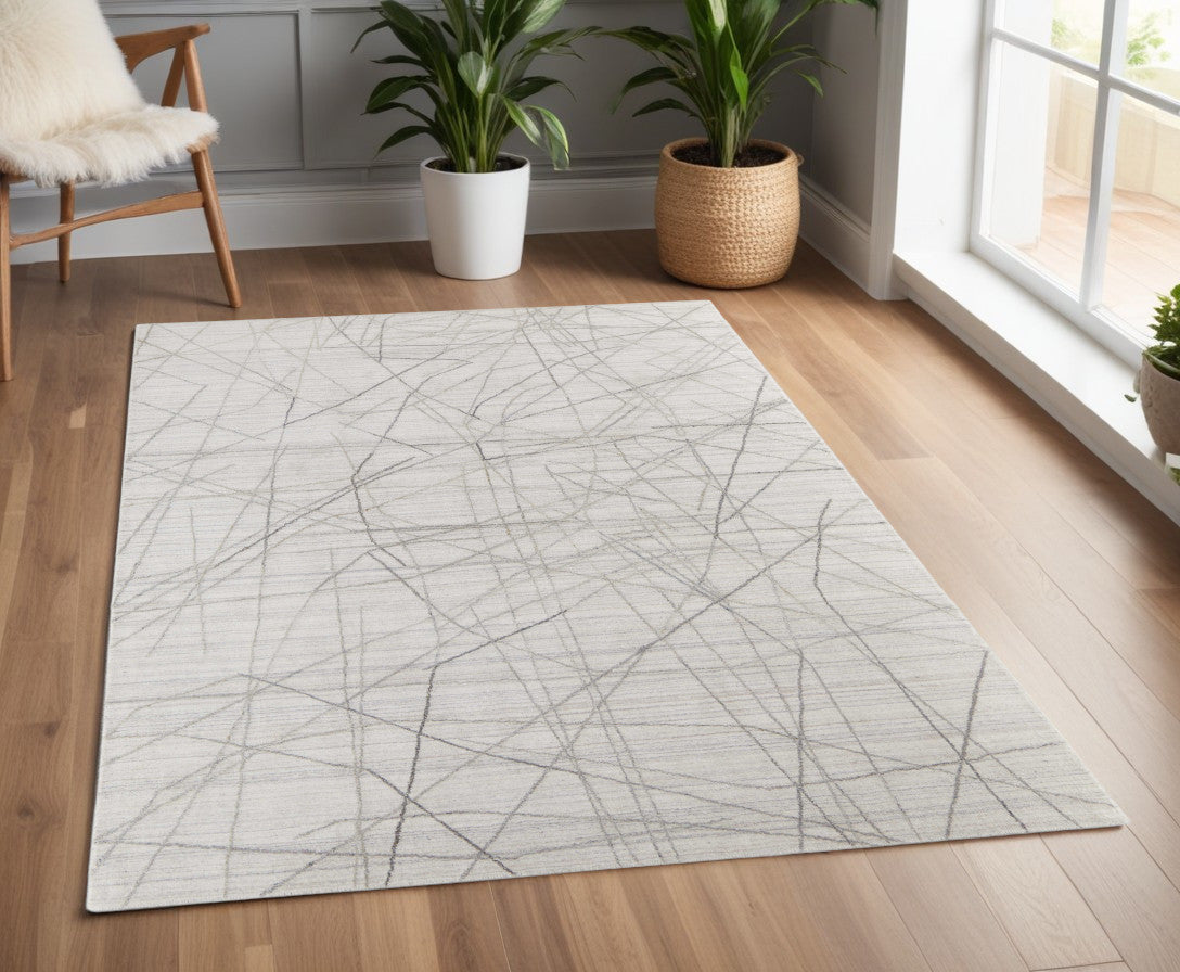 4' X 6' Gray and Ivory Abstract Hand Woven Area Rug