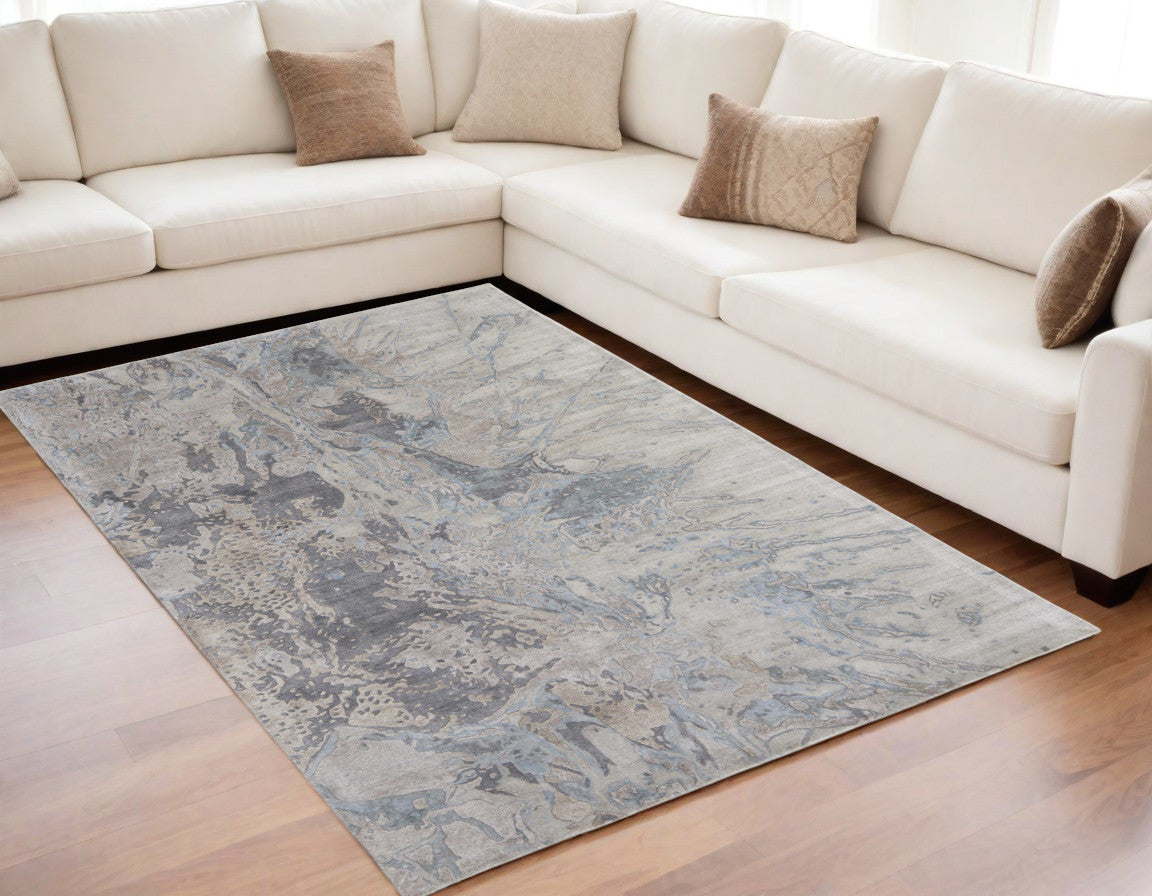 5' X 8' Gray Tan and Green Abstract Hand Tufted Worn Faded Area Rug