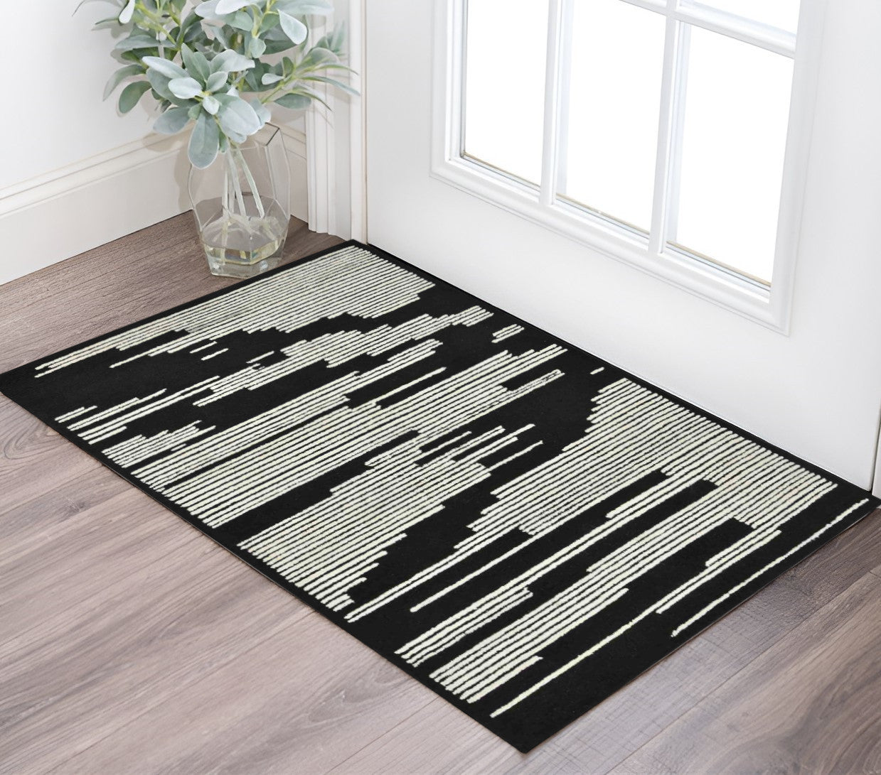 2 X 3 Black And Ivory Wool Abstract Hand Hooked Area Rug
