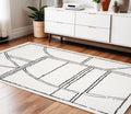 4 X 6 Ivory And Black Geometric Area Rug