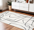 4 X 6 Ivory And Black Abstract Area Rug