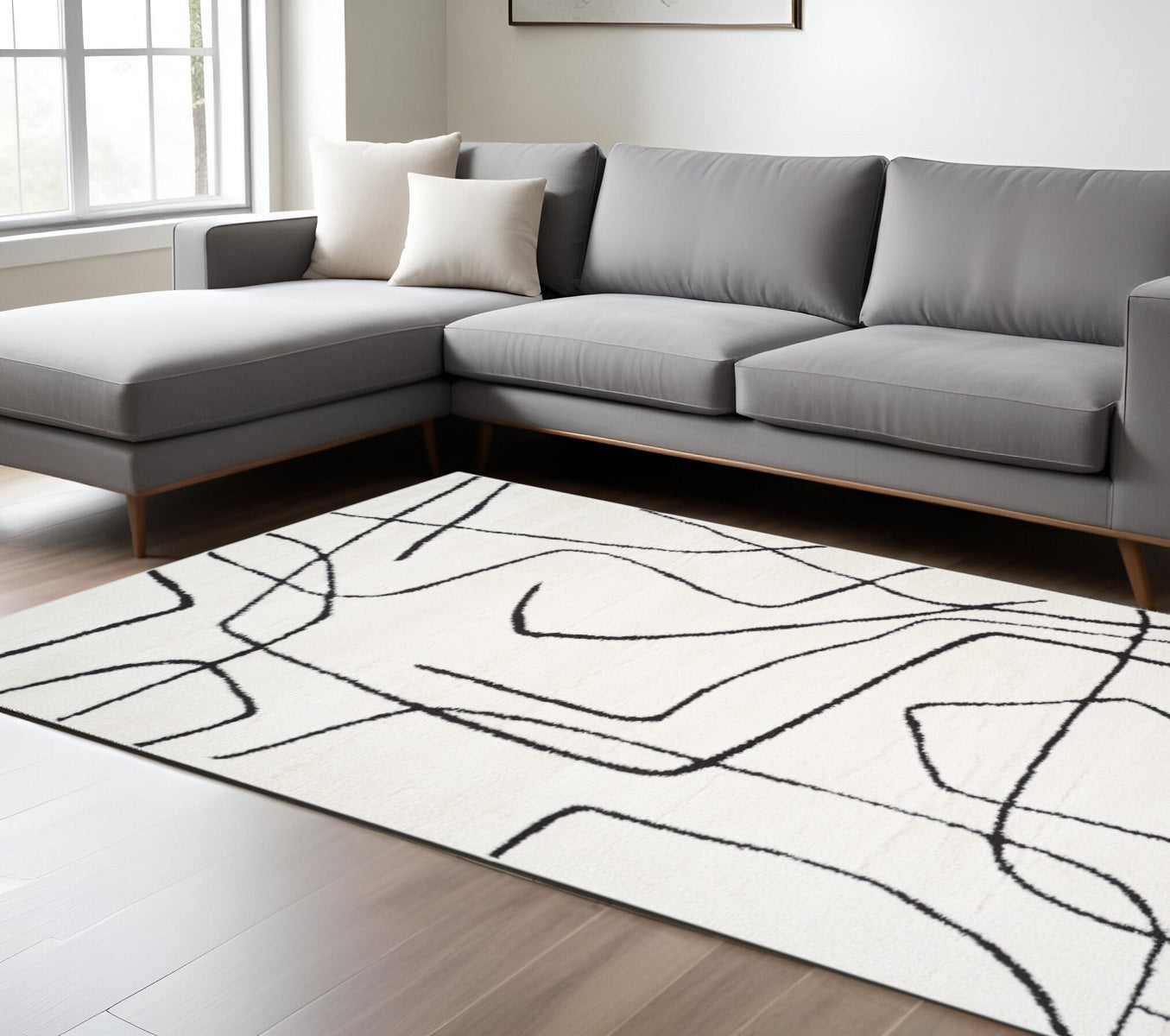 9 X 12 Ivory And Black Abstract Area Rug