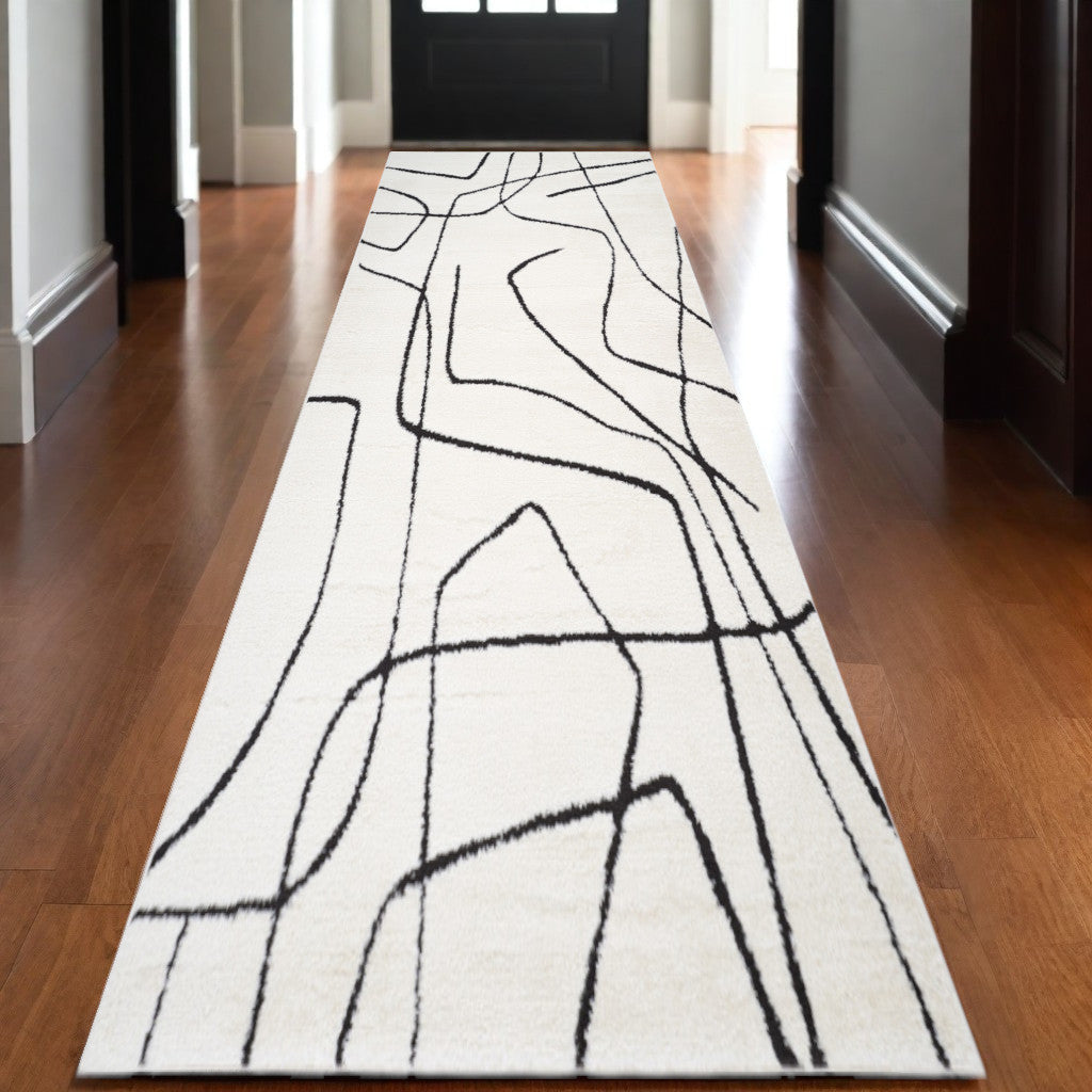 3 X 10 Ivory And Black Abstract Runner Rug
