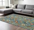 7' X 10' Blue Yellow And Ivory Oriental Area Rug With Fringe
