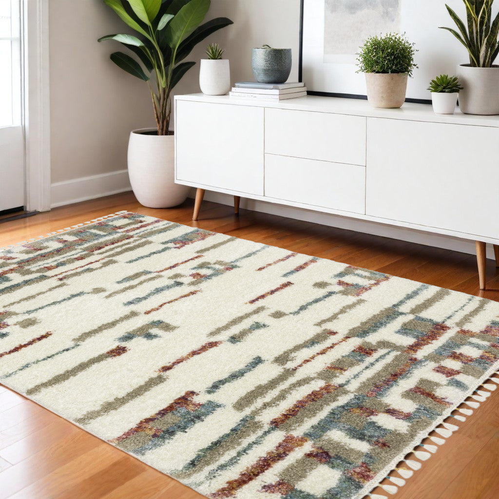 4' X 5' Tan Gray And Ivory Abstract Shag Distressed Area Rug With Fringe