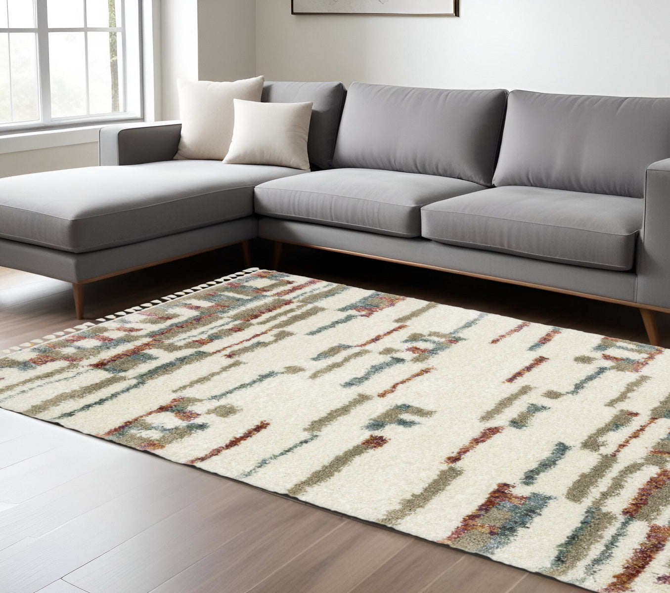 7' X 10' Tan Gray And Ivory Abstract Shag Distressed Area Rug With Fringe