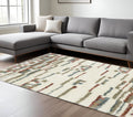 8' X 11' Tan Gray And Ivory Abstract Shag Distressed Area Rug With Fringe