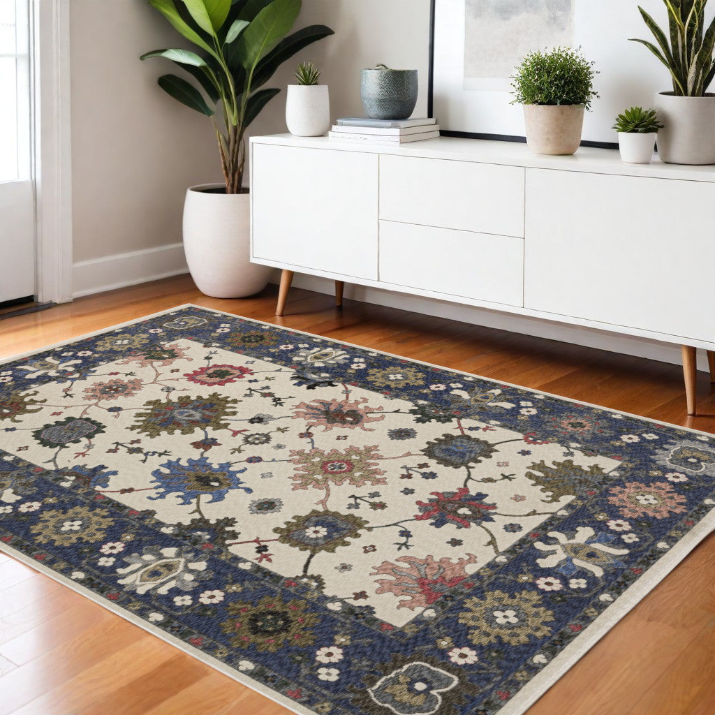 4' X 6' Blue And Ivory Floral Area Rug With Fringe