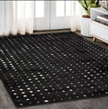 5' X 8' Black And Ivory Geometric Area Rug