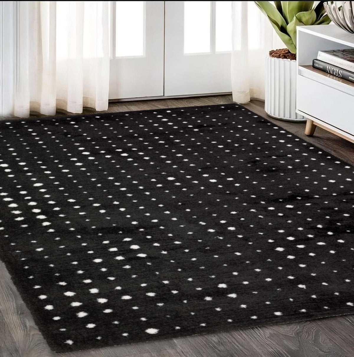 5' X 8' Black And Ivory Geometric Area Rug