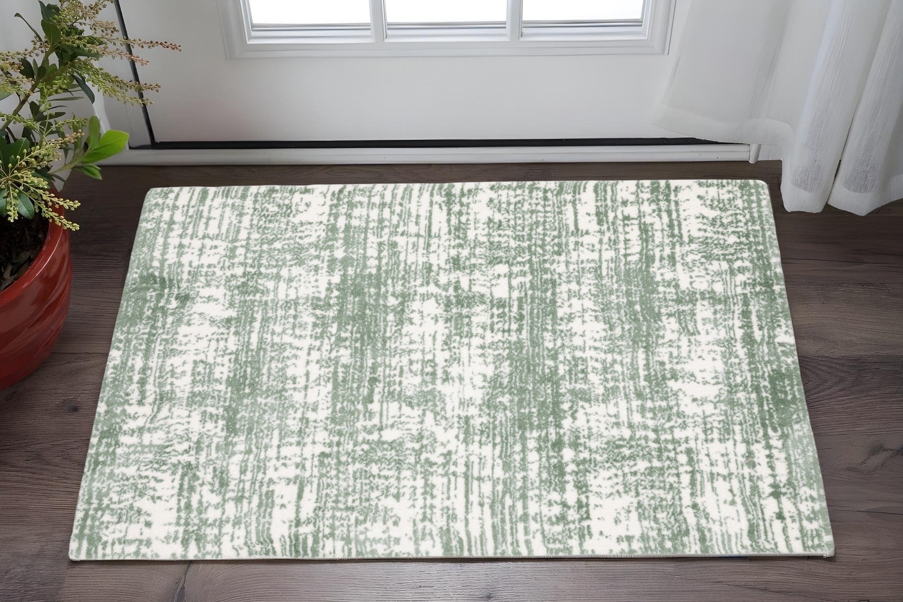 2' X 3' Green And Ivory Abstract Area Rug