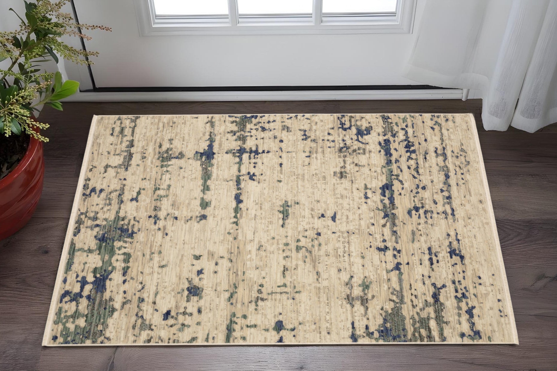 3' X 5' Beige And Green Abstract Area Rug With Fringe