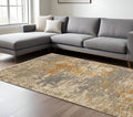 7' X 10' Beige And Gold Abstract Area Rug With Fringe