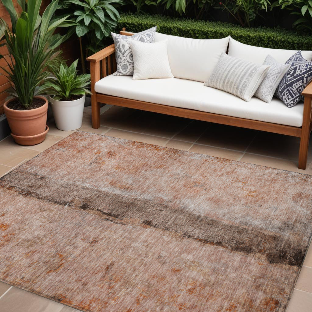 9' X 12' Orange Peach And Brown Abstract Washable Indoor Outdoor Area Rug