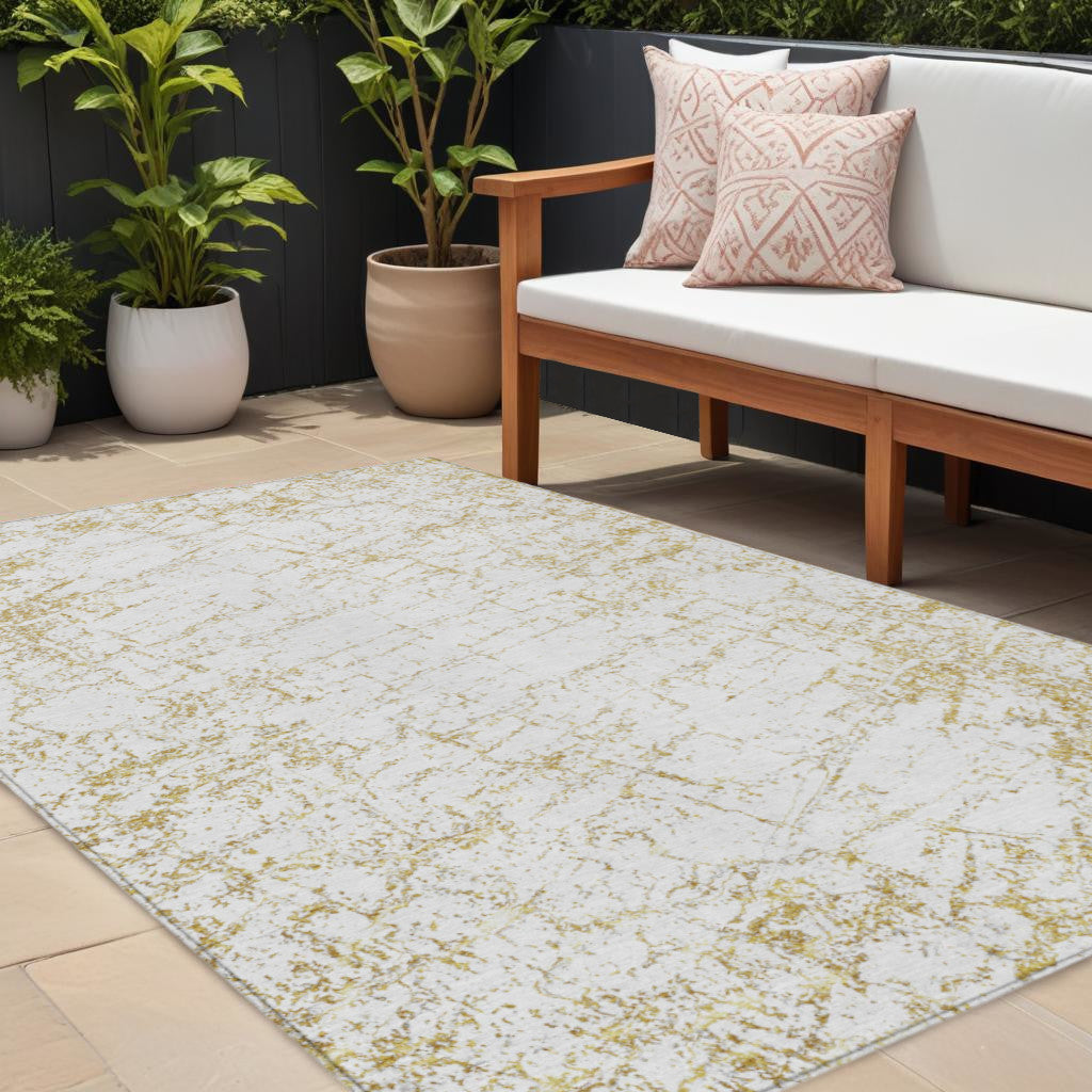 9' X 12' Gold And Ivory Abstract Washable Indoor Outdoor Area Rug