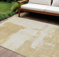 9' X 12' Beige Gold And Tan Abstract Washable Indoor Outdoor Area Rug