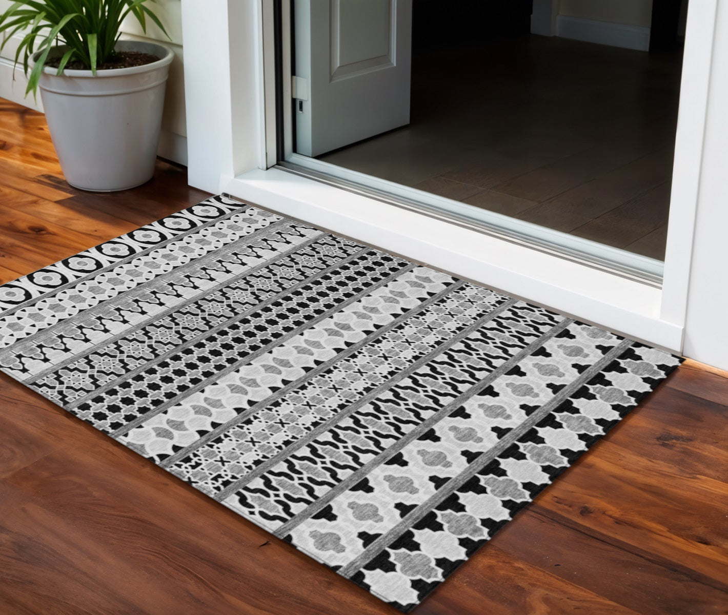 3' X 5' Black Gray And Ivory Quatrefoil Washable Indoor Outdoor Area Rug