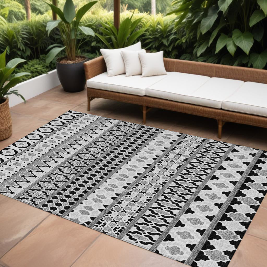 10' X 14' Black Gray And Ivory Quatrefoil Washable Indoor Outdoor Area Rug