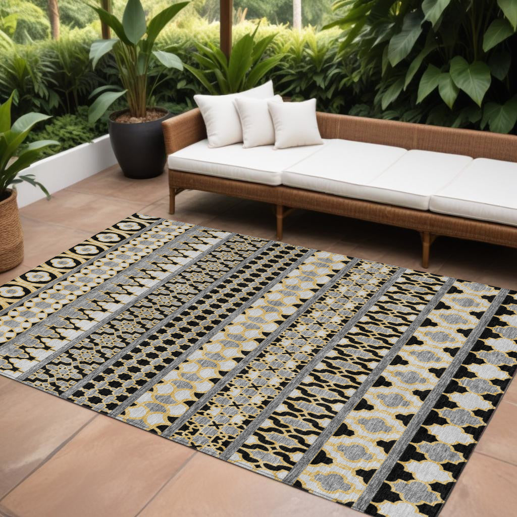 10' X 14' Charcoal Gray And Gold Quatrefoil Washable Indoor Outdoor Area Rug
