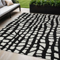 5' X 8' Black And Ivory Abstract Washable Indoor Outdoor Area Rug